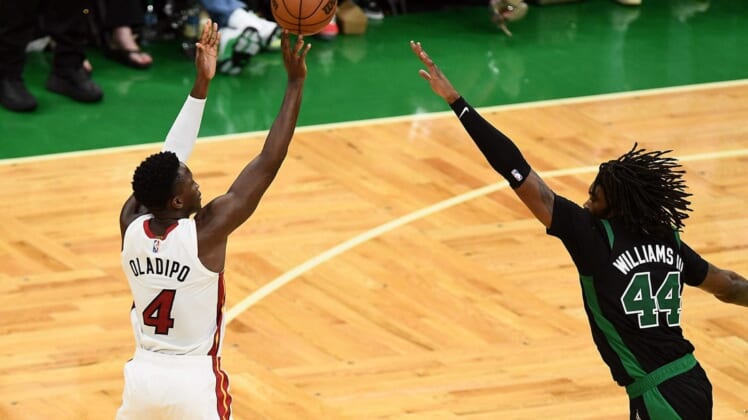 May 27, 2022; Boston, Massachusetts, USA; Miami Heat guard Victor Oladipo (4) shoots against Boston Celtics center Robert Williams III (44) during the second half in game six of the 2022 eastern conference finals at TD Garden. Mandatory Credit: Brian Fluharty-USA TODAY Sports