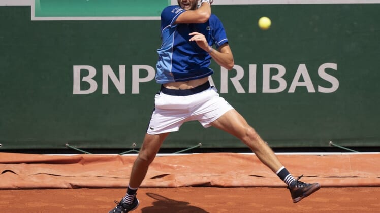 May 28, 2022; Paris, France; Daniil Medvedev returns a shot from Miomir Kecmanovic (SRB) during their match on day seven of the French Open at Stade Roland-Garros. Mandatory Credit: Susan Mullane-USA TODAY Sports