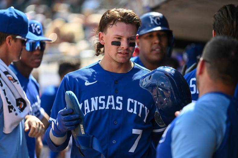 May 28, 2022; Minneapolis, Minnesota, USA; Royals shortstop Bobby Witt (7) celebrates scoring a run against the Minnesota Twins with teammates in the dugout during the seventh inning at Target Field. Mandatory Credit: Nick Wosika-USA TODAY Sports