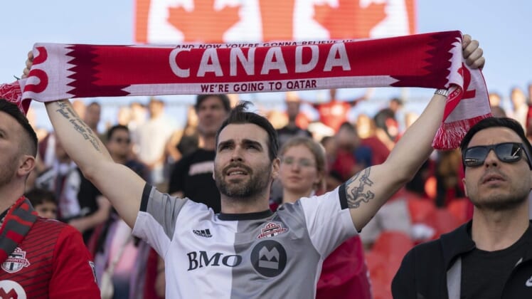 May 28, 2022; Toronto, Ontario, CAN; Toronto FC fans show their support during the national anthem before a match against the Chicago Fire at BMO Field. Mandatory Credit: Nick Turchiaro-USA TODAY Sports