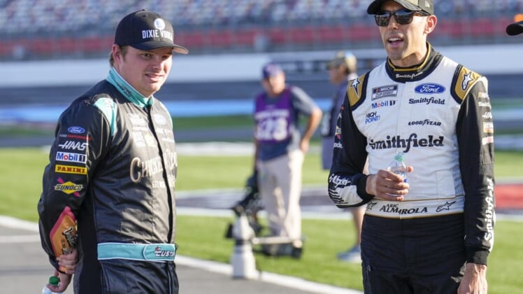 May 28, 2022; Concord, North Carolina, USA; NASCAR Cup Series driver Aric Almirola (10) and driver Cole Custer (41) talk during Nascar Cup Practice at Charlotte Motor Speedway. Mandatory Credit: Jim Dedmon-USA TODAY Sports