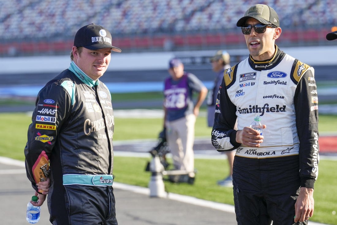 May 28, 2022; Concord, North Carolina, USA; NASCAR Cup Series driver Aric Almirola (10) and driver Cole Custer (41) talk during Nascar Cup Practice at Charlotte Motor Speedway. Mandatory Credit: Jim Dedmon-USA TODAY Sports