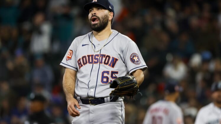 May 28, 2022; Seattle, Washington, USA; Houston Astros starting pitcher Jose Urquidy (65) reacts after surrendering an RBI-single against the Seattle Mariners during the second inning at T-Mobile Park. Mandatory Credit: Joe Nicholson-USA TODAY Sports