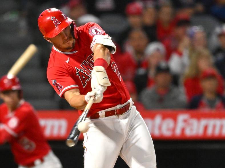May 28, 2022; Anaheim, California, USA;  Los Angeles Angels center fielder Mike Trout (27) hits a two run home run in the seventh inning against the Toronto Blue Jays at Angel Stadium. Mandatory Credit: Jayne Kamin-Oncea-USA TODAY Sports