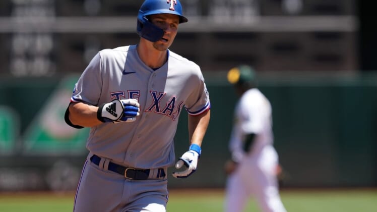May 29, 2022; Oakland, California, USA; Texas Rangers shortstop Corey Seager (5) rounds the bases after hitting a home run against the Oakland Athletics during the first inning at RingCentral Coliseum. Mandatory Credit: Darren Yamashita-USA TODAY Sports