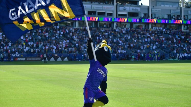 May 29, 2022; Carson, California, USA; Los Angeles Galaxy mascot Cozmo celebrates the victory against Austin FC at Dignity Health Sports Park. Mandatory Credit: Gary A. Vasquez-USA TODAY Sports