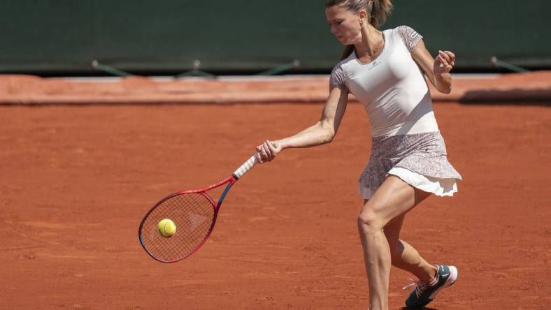 May 30, 2022; Paris, France; Camila Giorgi (ITA) returns a shot during her match against Daria Kasatkina on day nine of the French Open at Stade Roland-Garros. Mandatory Credit: Susan Mullane-USA TODAY Sports