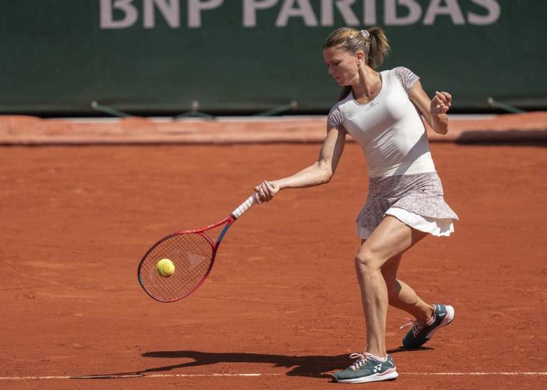 May 30, 2022; Paris, France; Camila Giorgi (ITA) returns a shot during her match against Daria Kasatkina on day nine of the French Open at Stade Roland-Garros. Mandatory Credit: Susan Mullane-USA TODAY Sports