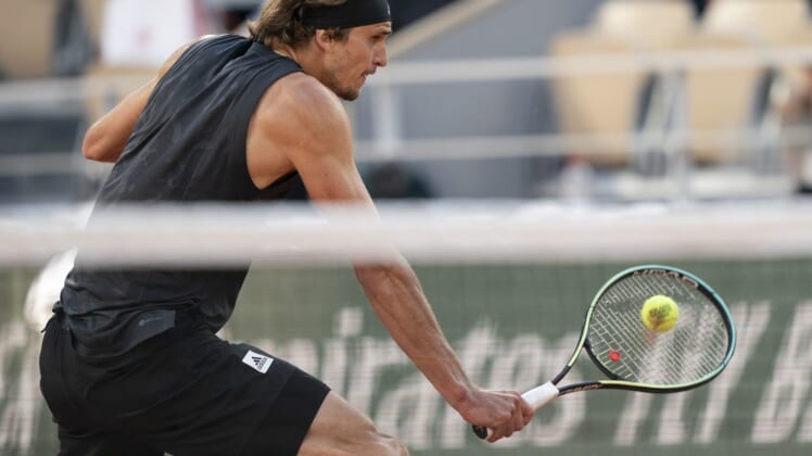 May 31, 2022; Paris, France; Alexander Zverev (GER) returns a shot during his  match against Carlos Alcaraz (ESP) on day 10 of the French Open at Stade Roland-Garros. Mandatory Credit: Susan Mullane-USA TODAY Sports