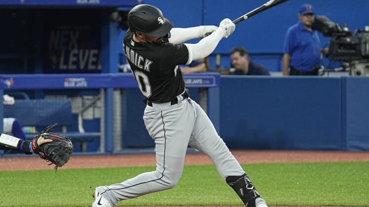 May 31, 2022; Toronto, Ontario, CAN; Chicago White Sox shortstop Danny Mendick (20) hits a one run double against the Toronto Blue Jays during the fifth inning at Rogers Centre. Mandatory Credit: John E. Sokolowski-USA TODAY Sports