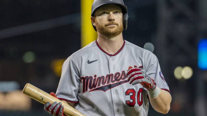 May 31, 2022; Detroit, Michigan, USA; Minnesota Twins left fielder Kyle Garlick (30) walks back to the dugout after an at bat during the ninth inning against the Detroit Tigers at Comerica Park. Mandatory Credit: Raj Mehta-USA TODAY Sports