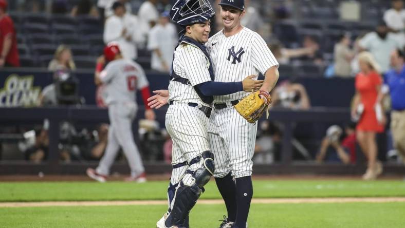 May 31, 2022; Bronx, New York, USA;  New York Yankees catcher Jose Trevino (39) and pitcher David McKay (71) celebrate after defeating the Los Angeles Angels 9-1 at Yankee Stadium. Mandatory Credit: Wendell Cruz-USA TODAY Sports