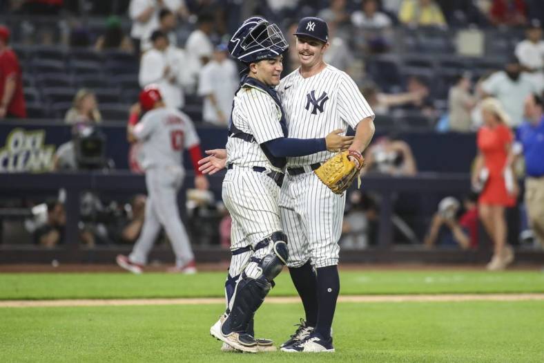 May 31, 2022; Bronx, New York, USA;  New York Yankees catcher Jose Trevino (39) and pitcher David McKay (71) celebrate after defeating the Los Angeles Angels 9-1 at Yankee Stadium. Mandatory Credit: Wendell Cruz-USA TODAY Sports