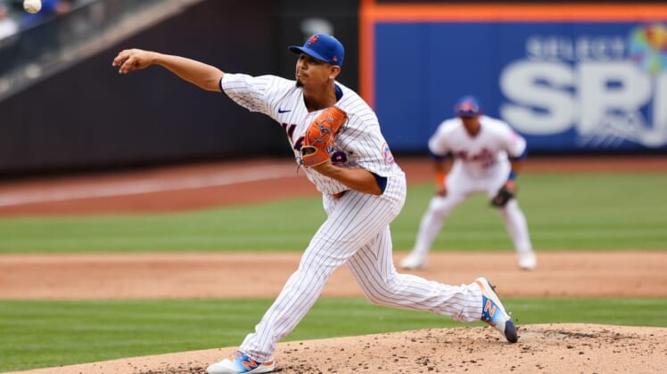 Jun 1, 2022; New York City, New York, USA; New York Mets starting pitcher Carlos Carrasco (59) throws a pitch against the Washington Nationals during the third inning at Citi Field. Mandatory Credit: Jessica Alcheh-USA TODAY Sports