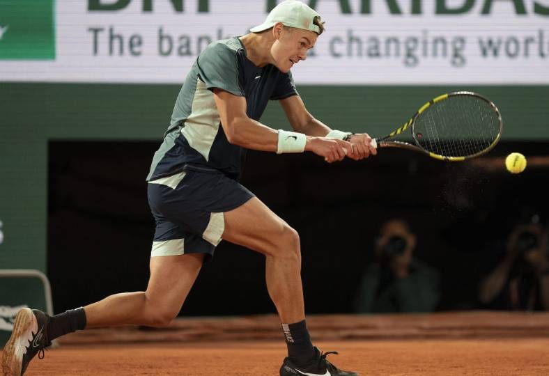 June 1, 2022; Paris, France; Holger Rune (DEN) returns a shot during his match against Casper Ruud (NOR) on day 11 of the French Open at Stade Roland-Garros. Mandatory Credit: Susan Mullane-USA TODAY Sports