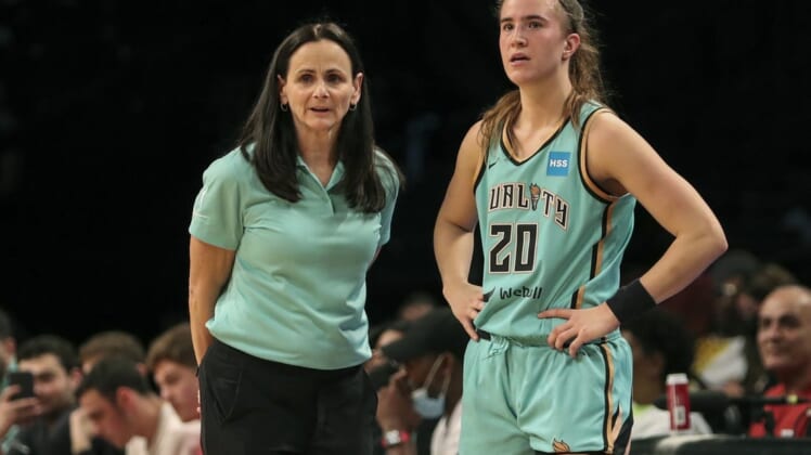 Jun 1, 2022; Brooklyn, New York, USA; New York Liberty head coach Sandy Brondello and guard Sabrina Ionescu (20) talk prior to a substitution in the first quarter against the Indiana Fever at Barclays Center. Mandatory Credit: Wendell Cruz-USA TODAY Sports