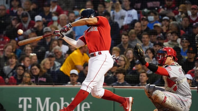 Jun 1, 2022; Boston, Massachusetts, USA; Boston Red Sox shortstop Xander Bogaerts (2) singled to center field to drive in two runs against the Cincinnati Reds in the fourth inning at Fenway Park. Mandatory Credit: David Butler II-USA TODAY Sports