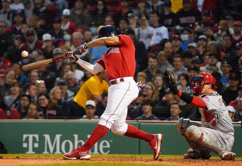 Jun 1, 2022; Boston, Massachusetts, USA; Boston Red Sox shortstop Xander Bogaerts (2) singled to center field to drive in two runs against the Cincinnati Reds in the fourth inning at Fenway Park. Mandatory Credit: David Butler II-USA TODAY Sports