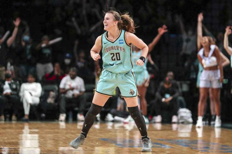Jun 1, 2022; Brooklyn, New York, USA; New York Liberty guard Sabrina Ionescu (20) celebrate after the Indiana Fever call timeout in the fourth quarter at Barclays Center. Mandatory Credit: Wendell Cruz-USA TODAY Sports