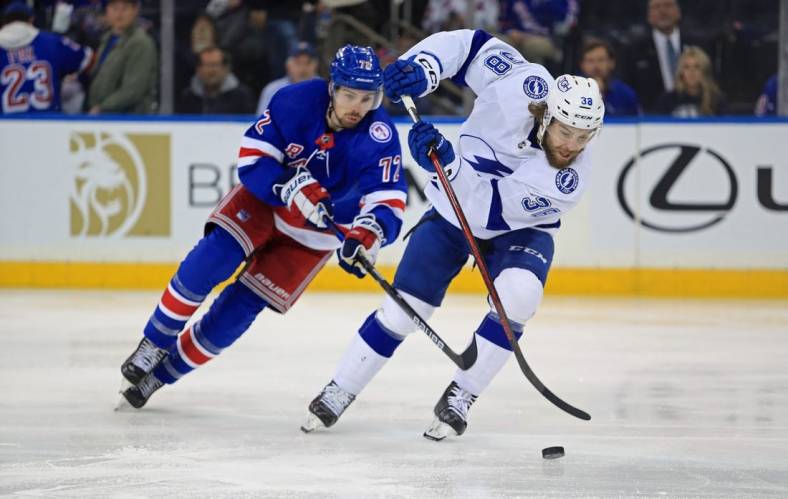 Jun 1, 2022; New York, New York, USA; New York Rangers center Filip Chytil (72) and Tampa Bay Lightning left wing Brandon Hagel (38) battle for the puck in the second period of game one of the Eastern Conference Final of the 2022 Stanley Cup Playoffs at Madison Square Garden. Mandatory Credit: Danny Wild-USA TODAY Sports