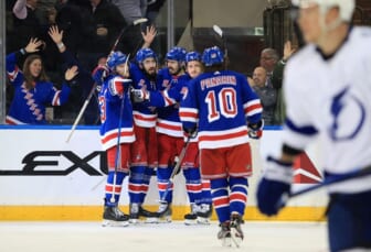 Jun 1, 2022; New York, New York, USA; New York Rangers center Mika Zibanejad (93) celebrates his goal against the Tampa Bay Lightning with left wing Chris Kreider (20) and defenseman Adam Fox (23) and center Ryan Strome (16) in the third period of game one of the Eastern Conference Final of the 2022 Stanley Cup Playoffs at Madison Square Garden. Mandatory Credit: Danny Wild-USA TODAY Sports