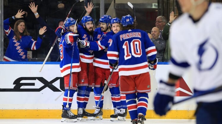 Jun 1, 2022; New York, New York, USA; New York Rangers center Mika Zibanejad (93) celebrates his goal against the Tampa Bay Lightning with left wing Chris Kreider (20) and defenseman Adam Fox (23) and center Ryan Strome (16) in the third period of game one of the Eastern Conference Final of the 2022 Stanley Cup Playoffs at Madison Square Garden. Mandatory Credit: Danny Wild-USA TODAY Sports