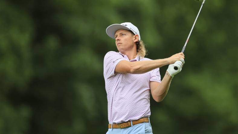 Jun 2, 2022; Dublin, Ohio, USA; Cameron Smith watches his shot from the ninth fairway during the first round of the Memorial Tournament. Mandatory Credit: Aaron Doster-USA TODAY Sports