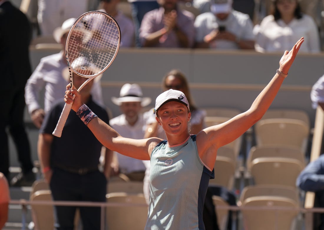 June 2, 2022; Paris, France; Iga Swiatek (POL) celebrates winning her semifinal match against Daria Kasatkina on day 12 of the French Open at Stade Roland-Garros. Mandatory Credit: Susan Mullane-USA TODAY Sports