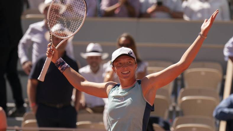 June 2, 2022; Paris, France; Iga Swiatek (POL) celebrates winning her semifinal match against Daria Kasatkina on day 12 of the French Open at Stade Roland-Garros. Mandatory Credit: Susan Mullane-USA TODAY Sports