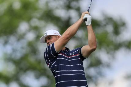 Jun 2, 2022; Dublin, Ohio, USA; Bryson DeChambeau plays his shot from the ninth tee during the first round of the Memorial Tournament. Mandatory Credit: Aaron Doster-USA TODAY Sports