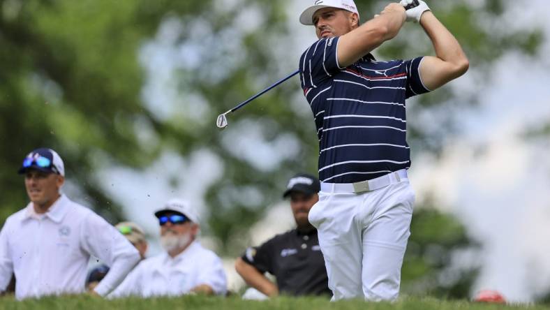 Jun 2, 2022; Dublin, Ohio, USA; Bryson DeChambeau plays his shot from the ninth tee during the first round of the Memorial Tournament. Mandatory Credit: Aaron Doster-USA TODAY Sports