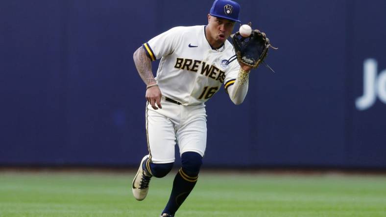 Jun 2, 2022; Milwaukee, Wisconsin, USA;  Milwaukee Brewers second baseman Kolten Wong (16) fields a ground ball during the first inning against the San Diego Padres at American Family Field. Mandatory Credit: Jeff Hanisch-USA TODAY Sports