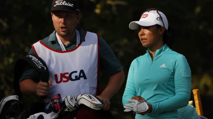 Jun 2, 2022; Southern Pines, North Carolina, USA; Danielle Kang (R) talks with her caddie (L) prior to hitting her tee shot on the twelfth hole during the first round of the U.S. Women's Open. Mandatory Credit: Geoff Burke-USA TODAY Sports