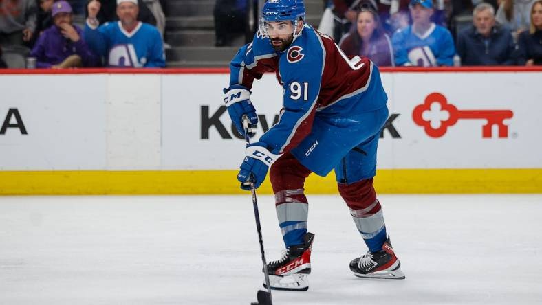 Jun 2, 2022; Denver, Colorado, USA; Colorado Avalanche center Nazem Kadri (91) controls the puck in the second period against the Edmonton Oilers in game two of the Western Conference Final of the 2022 Stanley Cup Playoffs at Ball Arena. Mandatory Credit: Isaiah J. Downing-USA TODAY Sports