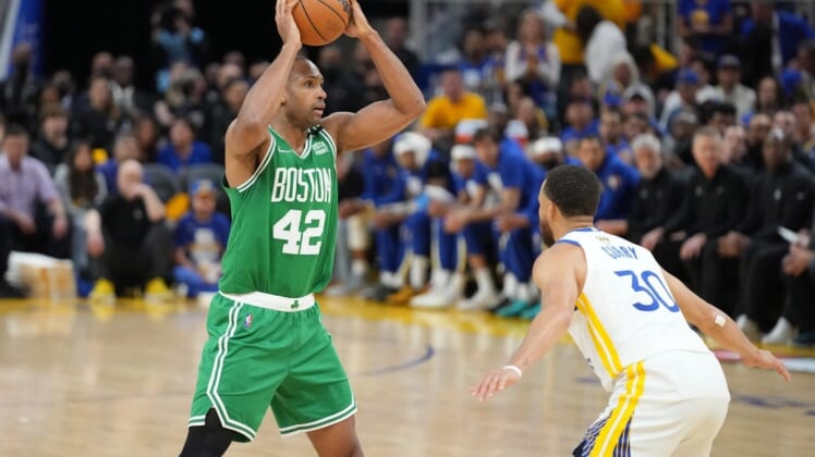 Jun 2, 2022; San Francisco, California, USA; Boston Celtics forward Al Horford (42) controls the ball while defended by Golden State Warriors guard Stephen Curry (30) during the third quarter in game one of the 2022 NBA Finals at Chase Center. Mandatory Credit: Kyle Terada-USA TODAY Sports