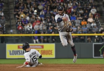 Jun 2, 2022; Denver, Colorado, USA; Colorado Rockies right fielder Randal Grichuk (15) is forced at second base as Atlanta Braves shortstop Dansby Swanson (7) completes the throw for a double play in the sixth inning at Coors Field. Mandatory Credit: John Leyba-USA TODAY Sports