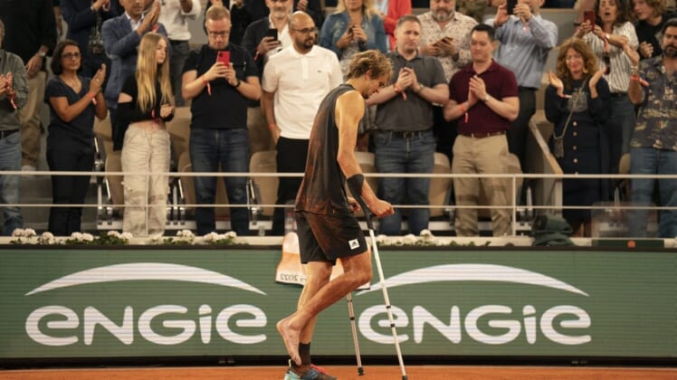 June 3, 2022; Paris, France; Alexander Zverev (GER) leaves the court on crutches after retiring from his semifinal match against Rafael Nadal (ESP)on day 13 of the French Open at Stade Roland-Garros. Mandatory Credit: Susan Mullane-USA TODAY Sports