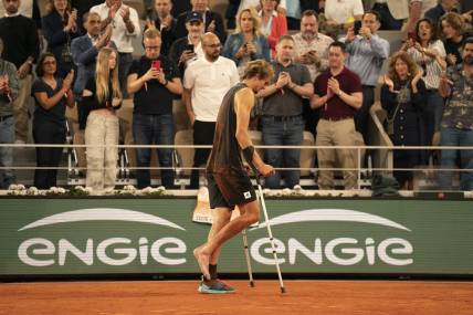 June 3, 2022; Paris, France; Alexander Zverev (GER) leaves the court on crutches after retiring from his semifinal match against Rafael Nadal (ESP)on day 13 of the French Open at Stade Roland-Garros. Mandatory Credit: Susan Mullane-USA TODAY Sports