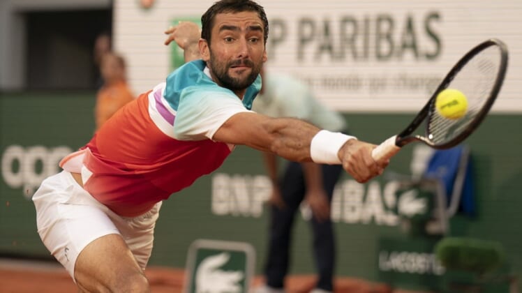 June 3, 2022; Paris, France; Marin Cilic (CRO) returns a shot during his  semifinal match against Casper Ruud (NOR) on day 13 of the French Open at Stade Roland-Garros. Mandatory Credit: Susan Mullane-USA TODAY Sports