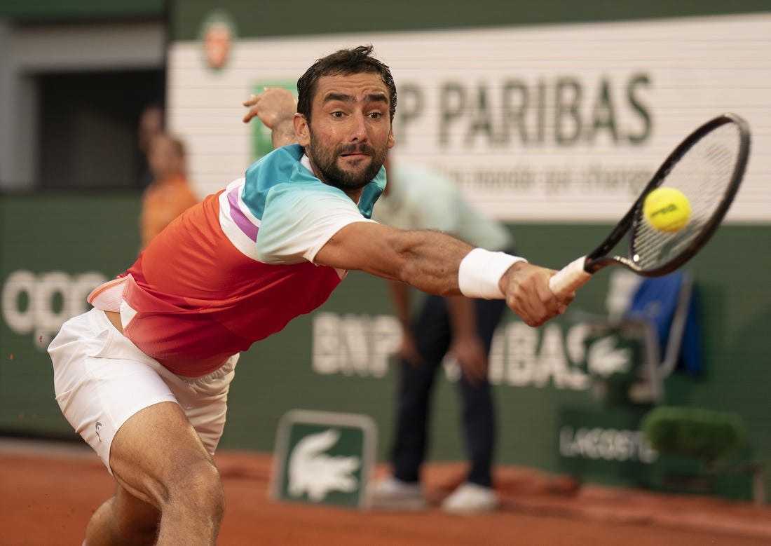 June 3, 2022; Paris, France; Marin Cilic (CRO) returns a shot during his  semifinal match against Casper Ruud (NOR) on day 13 of the French Open at Stade Roland-Garros. Mandatory Credit: Susan Mullane-USA TODAY Sports