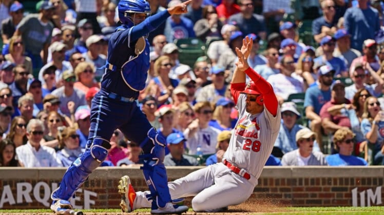 Jun 3, 2022; Chicago, Illinois, USA; St. Louis Cardinals third baseman Nolan Arenado (28) slides to score in the second inning against the Chicago Cubs at Wrigley Field. Mandatory Credit: Quinn Harris-USA TODAY Sports
