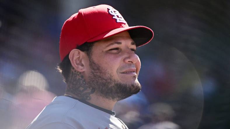 Jun 3, 2022; Chicago, Illinois, USA; St. Louis Cardinals catcher Yadier Molina (4) looks on from the dugout in the seventh inning against the Chicago Cubs at Wrigley Field. Mandatory Credit: Quinn Harris-USA TODAY Sports