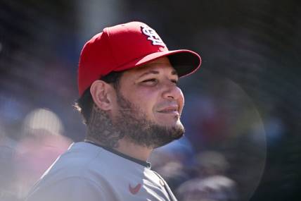 Jun 3, 2022; Chicago, Illinois, USA; St. Louis Cardinals catcher Yadier Molina (4) looks on from the dugout in the seventh inning against the Chicago Cubs at Wrigley Field. Mandatory Credit: Quinn Harris-USA TODAY Sports