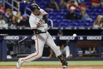 Jun 3, 2022; Miami, Florida, USA; San Francisco Giants first baseman Wilmer Flores (41) hits a single during the first inning against the Miami Marlins at loanDepot Park. Mandatory Credit: Sam Navarro-USA TODAY Sports