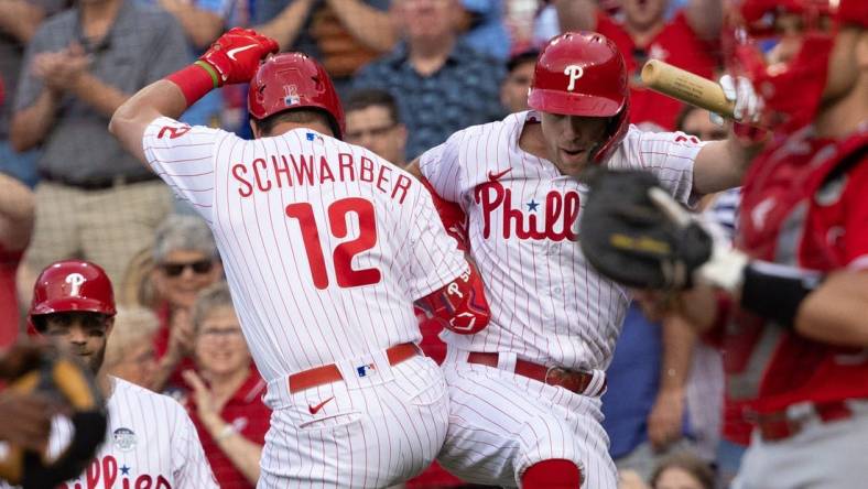 Jun 3, 2022; Philadelphia, Pennsylvania, USA; Philadelphia Phillies left fielder Kyle Schwarber (12) celebrates with first baseman Rhys Hoskins (17) after hitting a home run during the first inning against the Los Angeles Angels at Citizens Bank Park. Mandatory Credit: Bill Streicher-USA TODAY Sports