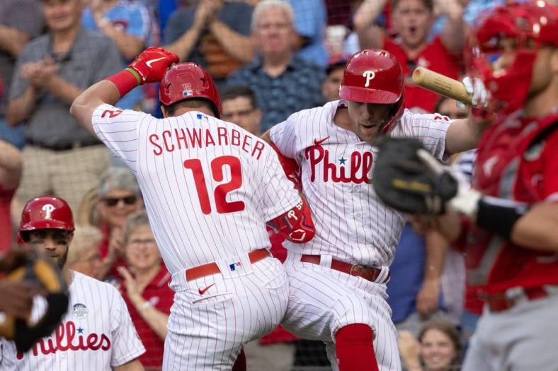Jun 3, 2022; Philadelphia, Pennsylvania, USA; Philadelphia Phillies left fielder Kyle Schwarber (12) celebrates with first baseman Rhys Hoskins (17) after hitting a home run during the first inning against the Los Angeles Angels at Citizens Bank Park. Mandatory Credit: Bill Streicher-USA TODAY Sports