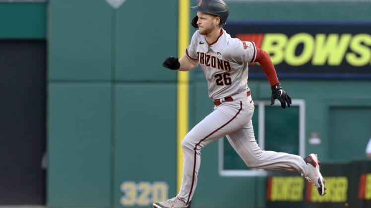 Jun 3, 2022; Pittsburgh, Pennsylvania, USA;  Arizona Diamondbacks designated hitter Pavin Smith (26) runs to second base after hitting a double against the Pittsburgh Pirates during the second inning at PNC Park. Mandatory Credit: Charles LeClaire-USA TODAY Sports