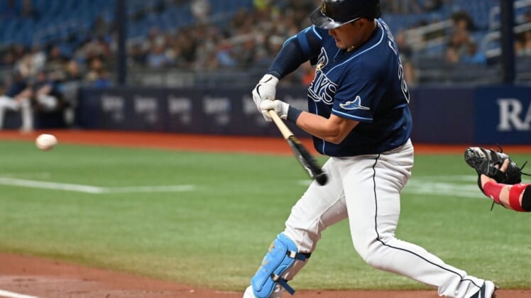 Jun 3, 2022; St. Petersburg, Florida, USA; Tampa Bay Rays first baseman Ji-Man Choi (26) hit an RBI sacrifice fly ball in the first inning against the Chicago White Sox at Tropicana Field. Mandatory Credit: Jonathan Dyer-USA TODAY Sports
