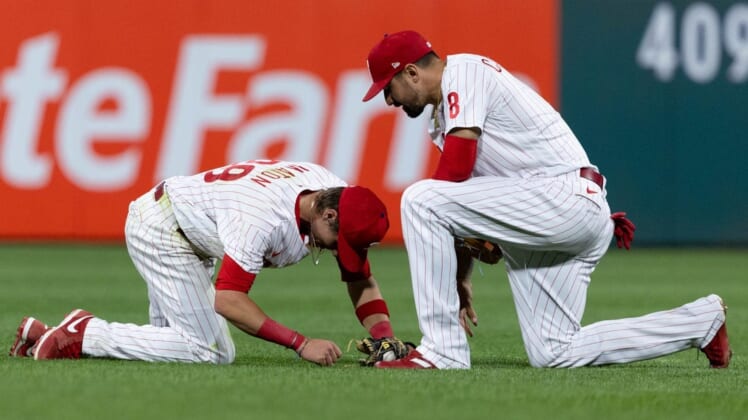 Jun 3, 2022; Philadelphia, Pennsylvania, USA; Philadelphia Phillies second baseman Nick Maton (29) is checked on by left fielder Nick Castellanos (8) after being shaken up on a diving play against the Los Angeles Angels during the sixth inning at Citizens Bank Park. Mandatory Credit: Bill Streicher-USA TODAY Sports