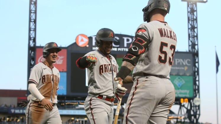 Jun 3, 2022; Pittsburgh, Pennsylvania, USA;  Arizona Diamondbacks second baseman Ketel Marte (middle) celebrates his two-run home run with first baseman Christian Walker (53) against the Pittsburgh Pirates during the fifth inning at PNC Park. Mandatory Credit: Charles LeClaire-USA TODAY Sports
